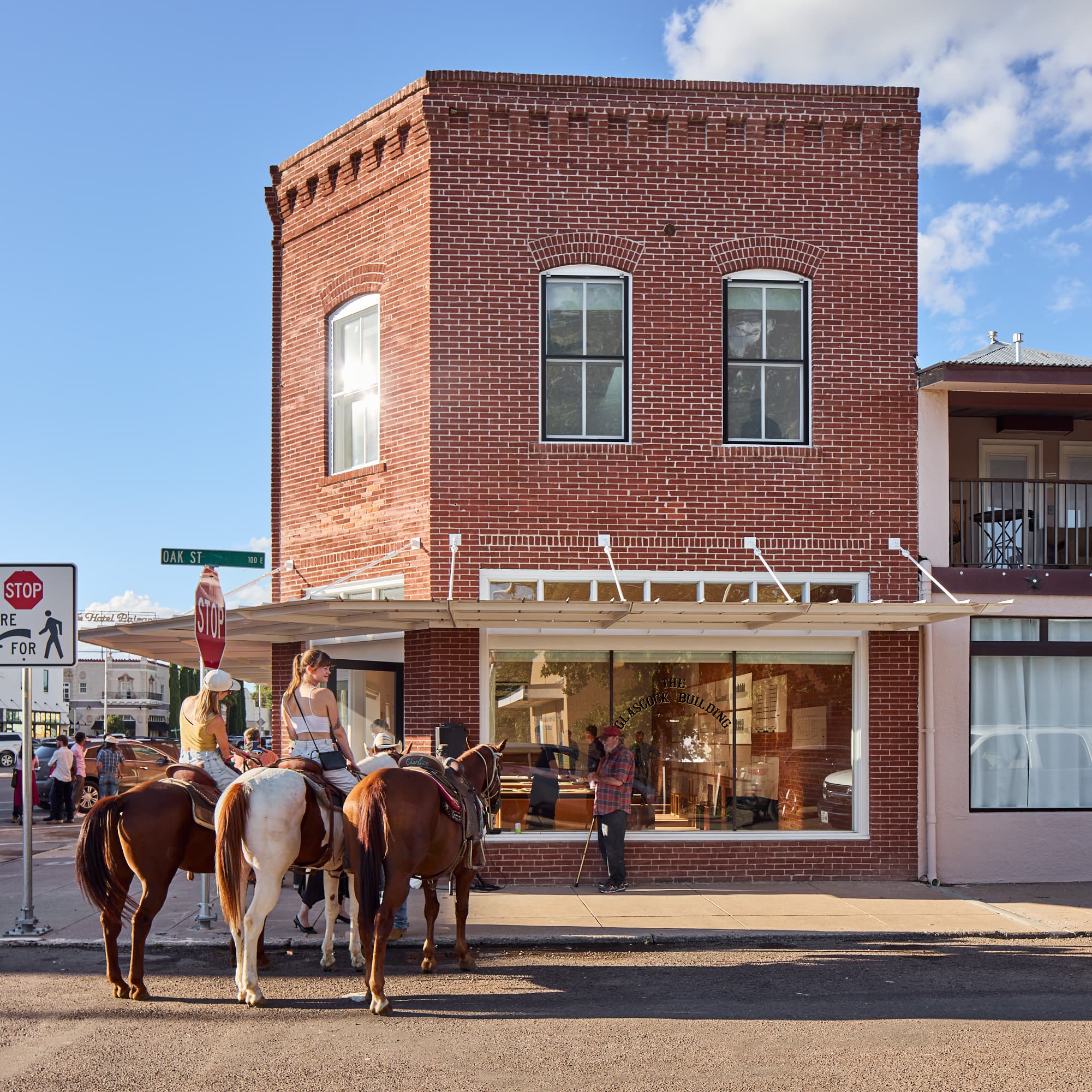 People on horseback outside Donald Judd's Architecture Office in Marfa, Texas, September 2025. 