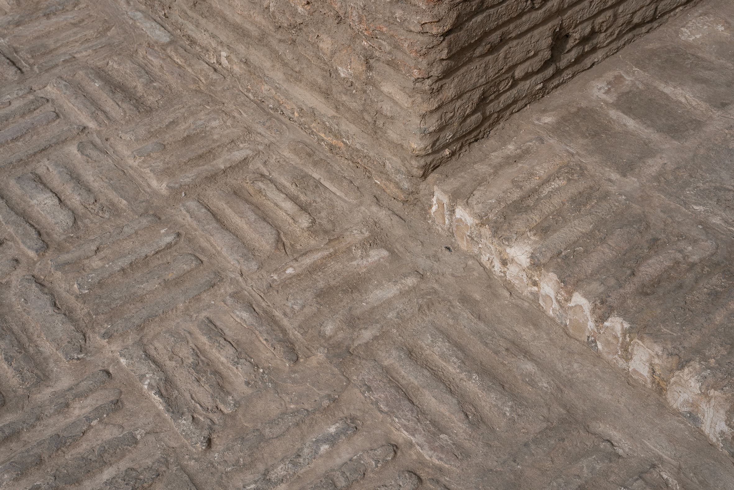New pavement in front of Magoki Attori Mosque using a traditional brickwork pattern.