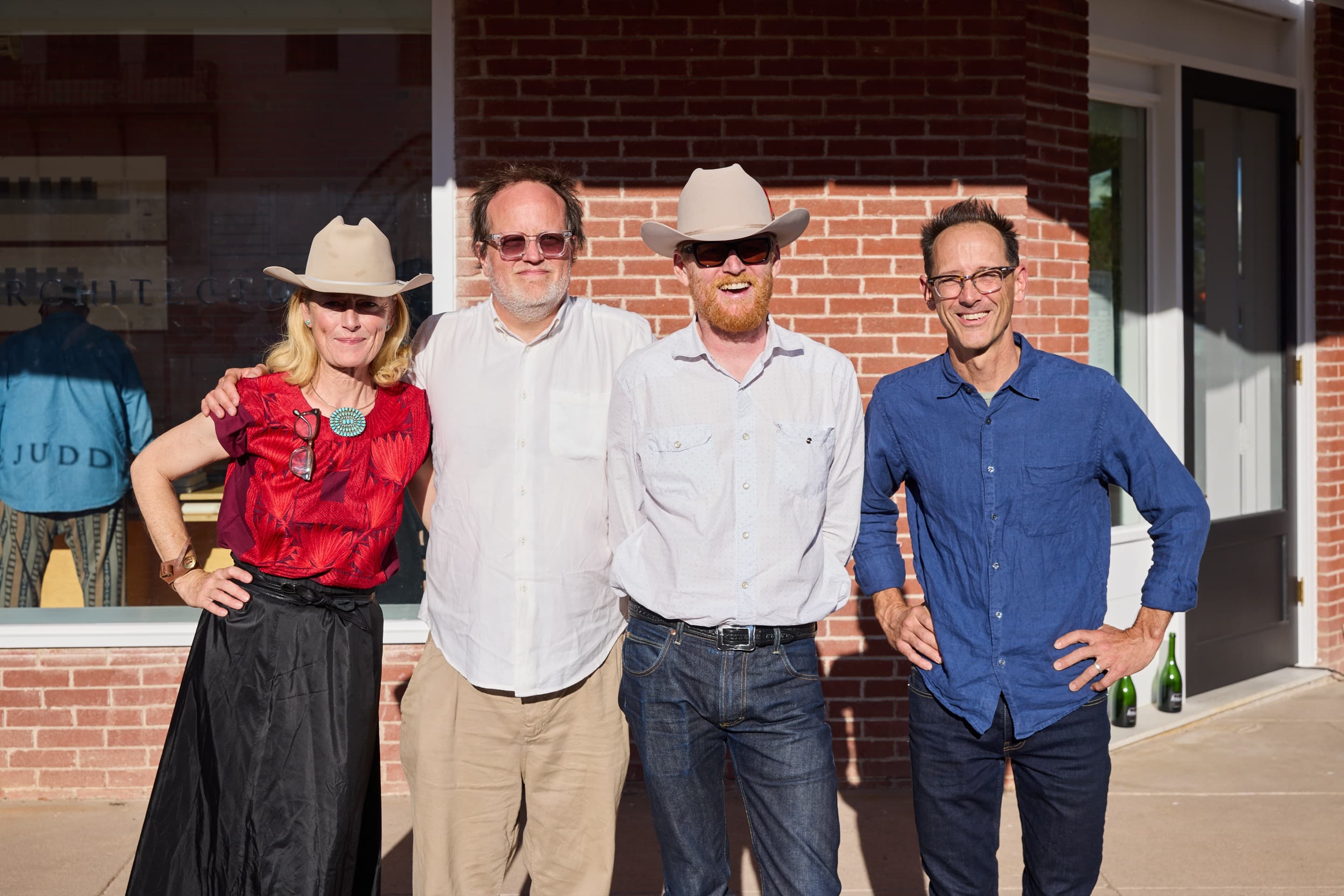 From left to right: Rainer Judd, Troy Schaum, Flavin Judd, and Peter Stanley during the opening of The Architecture Office, Judd Foundation, Marfa, Texas. 