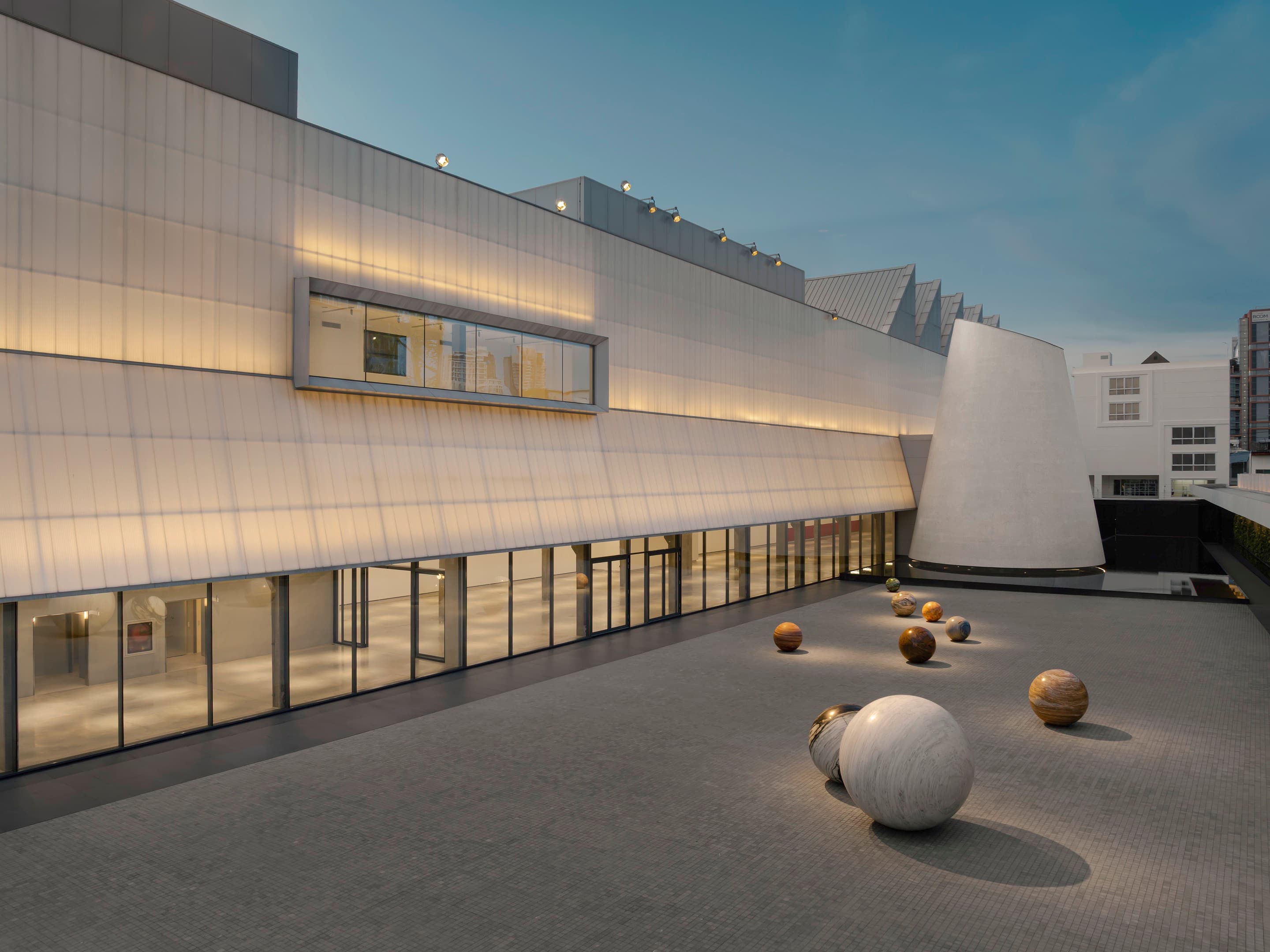 The stone spheres of Alicja Kwade’s Pars pro Toto (2020) in the Dib Bangkok Courtyard.