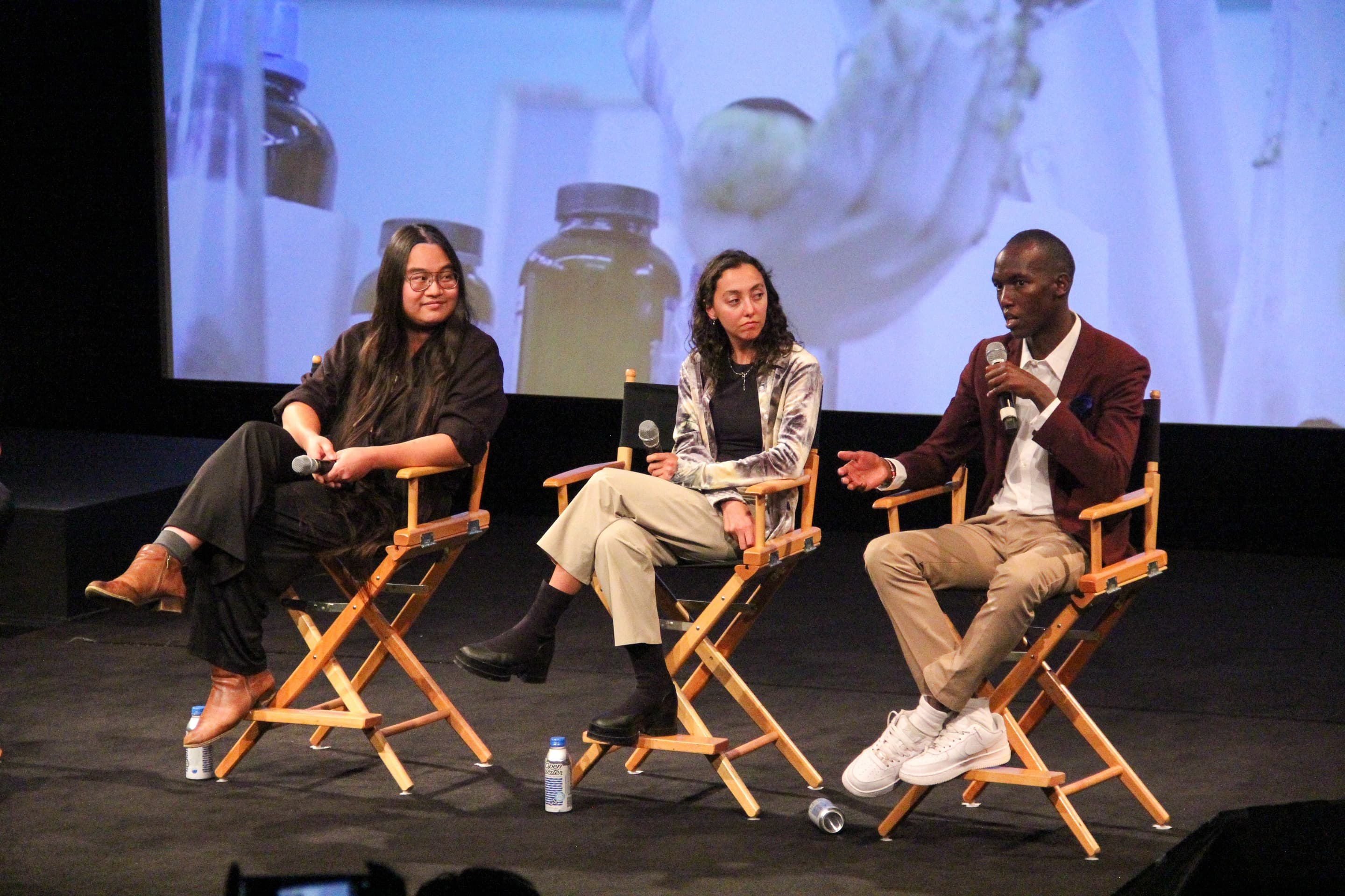 Alfonse Chiu, Pamela Elizarrarás Acitores, and Joseph Nguthiru on stage at the Climate Film Festival